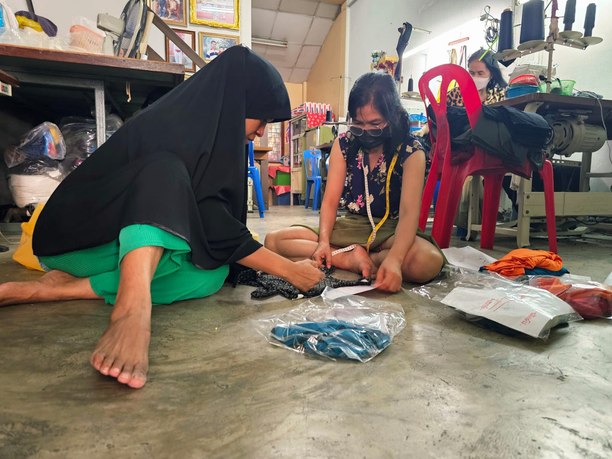 two master tailors in action